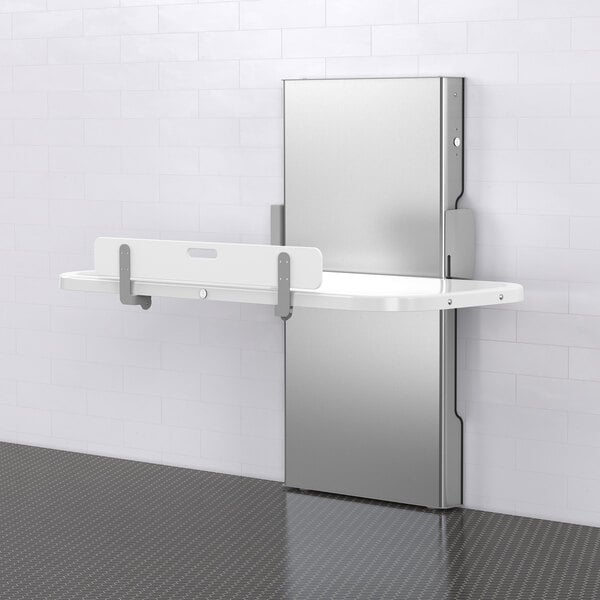 A white Foundations Ascent wall-mounted changing table.