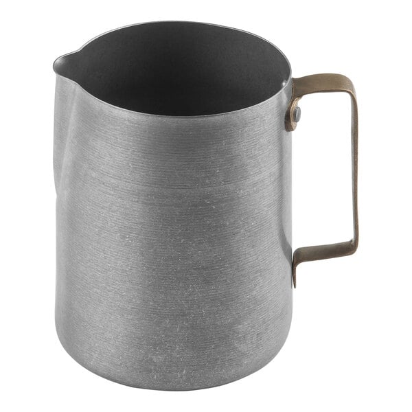 A Tablecraft stainless steel frothing pitcher with a vintage finish and gold handle.