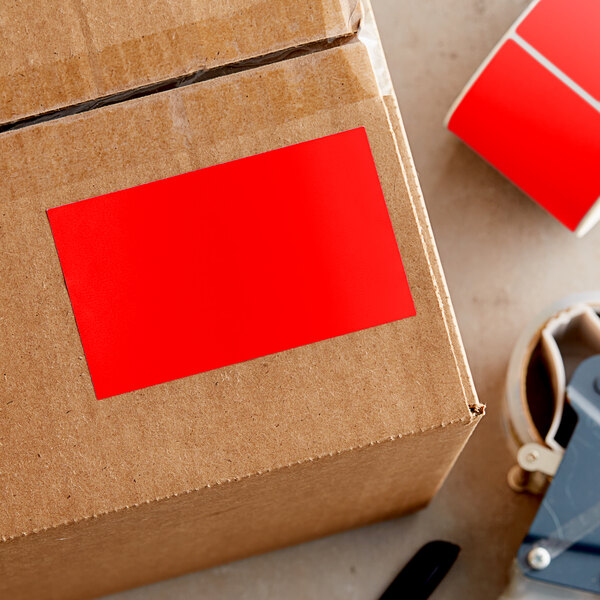 A cardboard box with a red rectangular label.