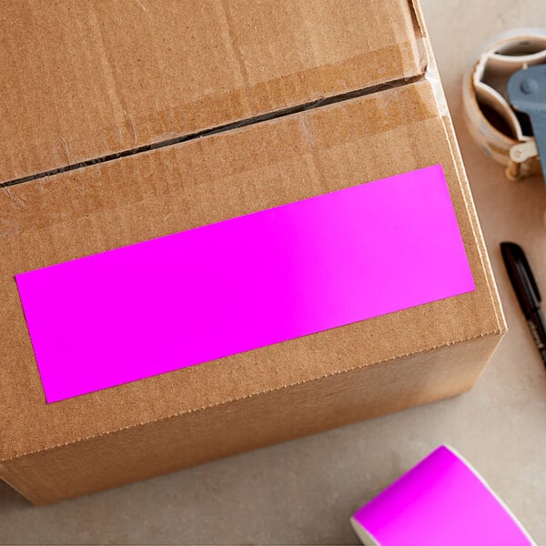 A cardboard box with a pink rectangular Lavex label.
