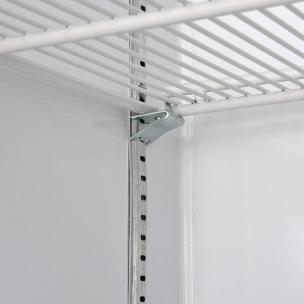A metal shelf with a metal rod.