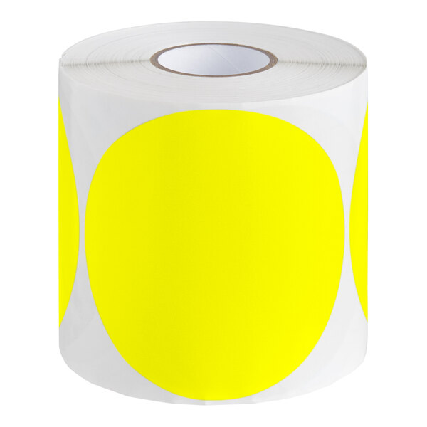 A roll of yellow Lavex round inventory labels with white backing.
