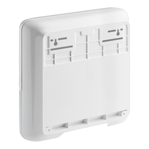 A white rectangular Tork mini wall-mount hand towel dispenser.