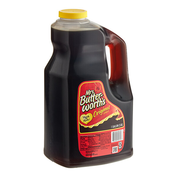 A jug of Mrs. Butterworth's Original breakfast syrup with a yellow lid.