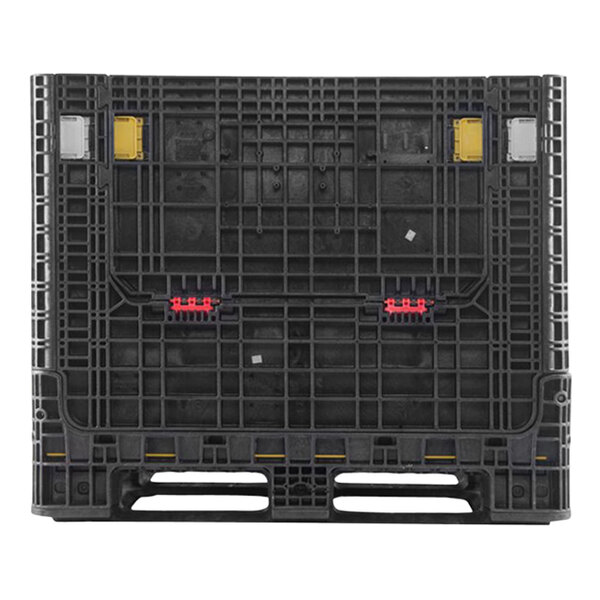 A black Orbis BulkPak container on a black plastic pallet with yellow and red parts.