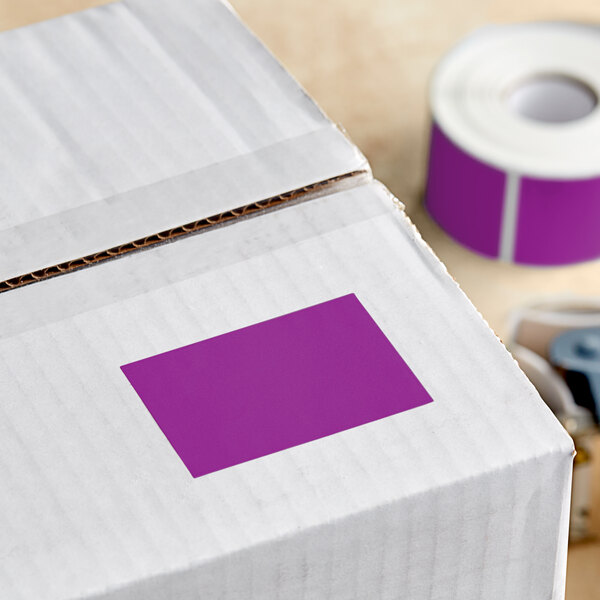 A box with a Lavex purple rectangular inventory label on it.