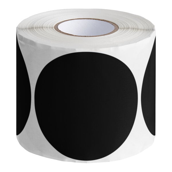 A roll of black round paper labels with white semi-gloss dots.