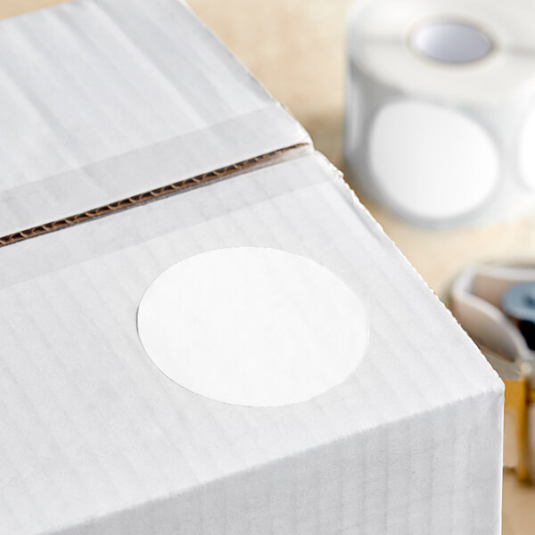 A white roll of Lavex round inventory labels with a white circle on it.