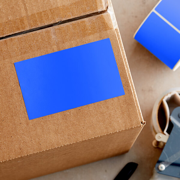 A cardboard box with a blue rectangular Lavex label on it.