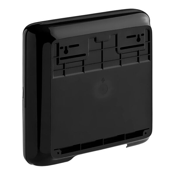 A black rectangular Tork mini multifold hand towel dispenser.