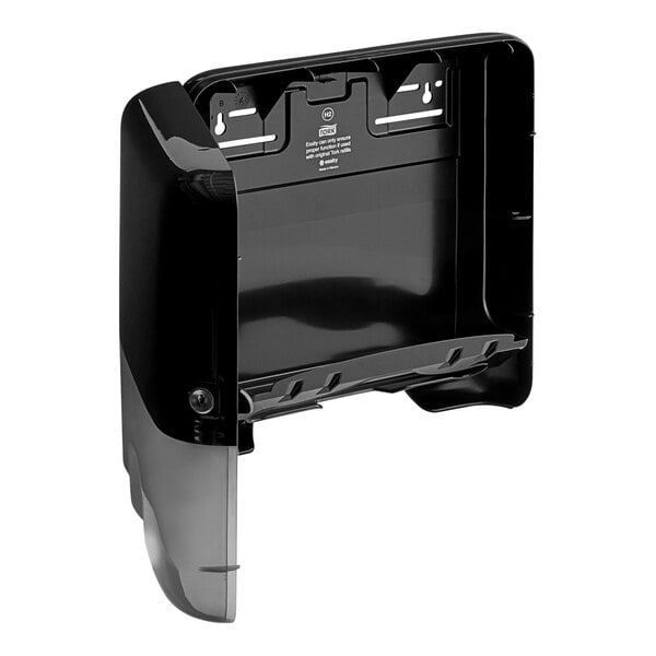 A black and silver Tork Xpress mini multifold hand towel dispenser.
