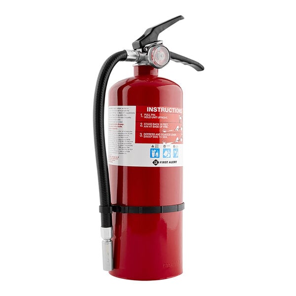 A red First Alert fire extinguisher with a hose nozzle.