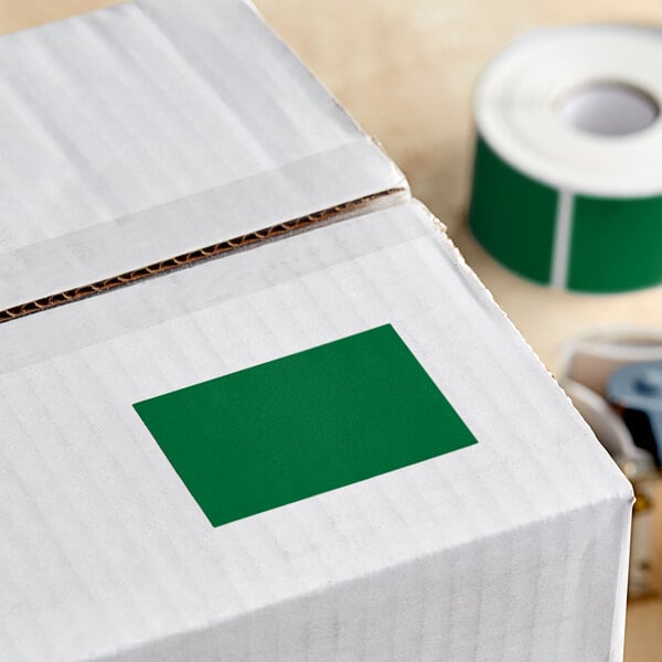 A white box with a roll of Lavex green rectangular inventory labels.