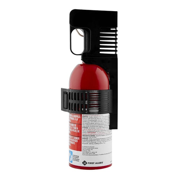 A First Alert fire extinguisher with a black handle and a red gas cylinder.