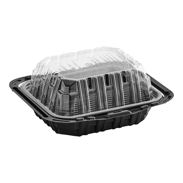 A black Pactiv chicken barn with a clear lid.