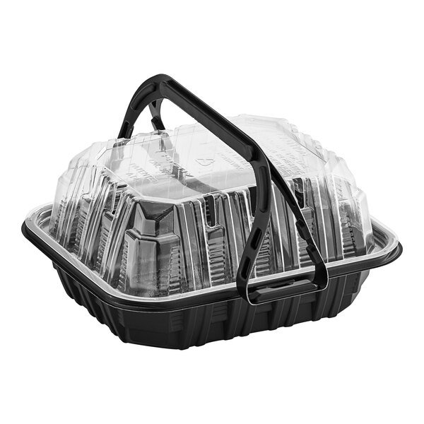 A black plastic Pactiv chicken barn with a handle.