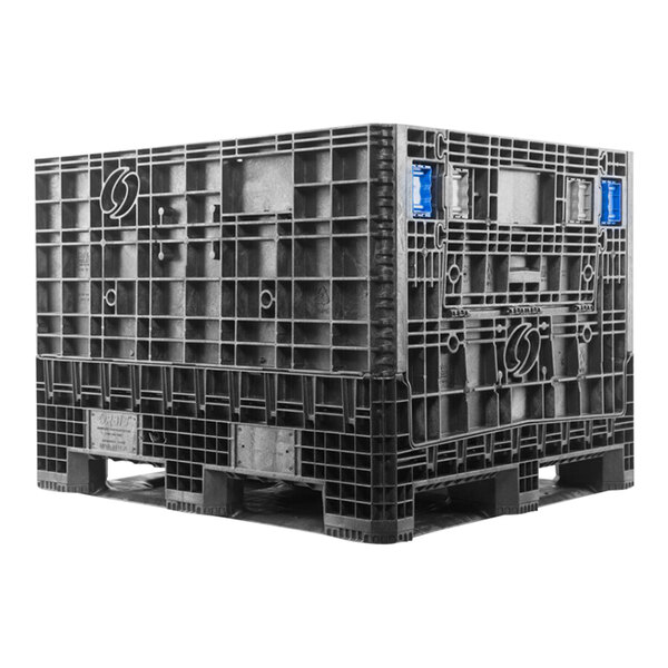 A black Orbis collapsible plastic container on a grey plastic pallet.
