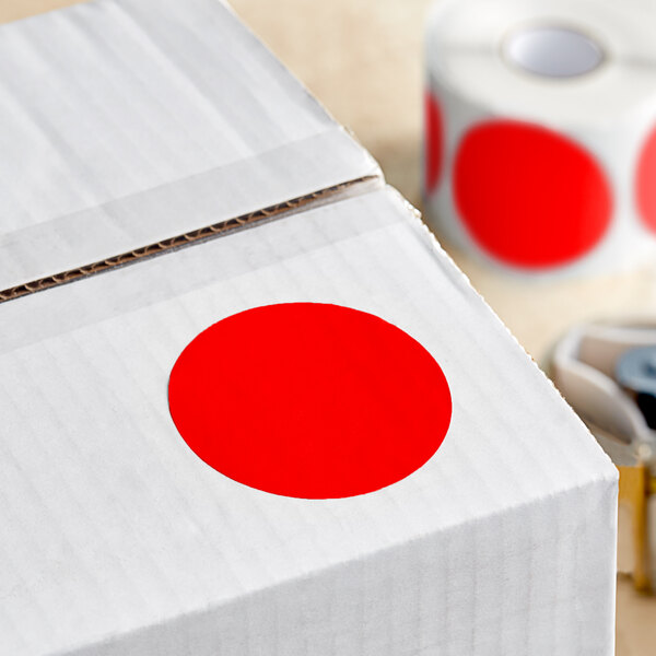 A roll of Lavex red round inventory labels with a red circle on the box.