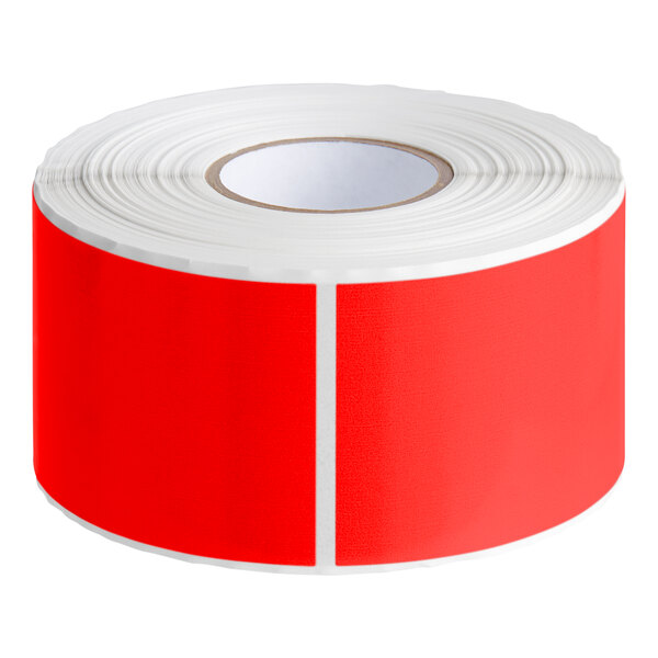 A roll of Lavex fluorescent red rectangular inventory labels with white stripes.