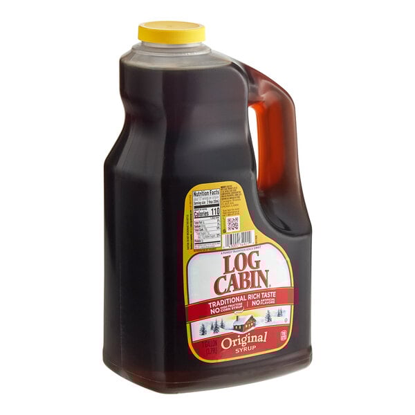 A jug of Log Cabin Original Breakfast Syrup with a brown label.