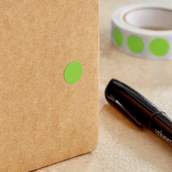 A brown box with a green circle label on it.