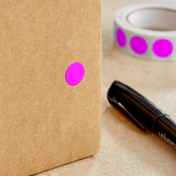 A roll of Lavex pink inventory labels with a purple dot on the box.