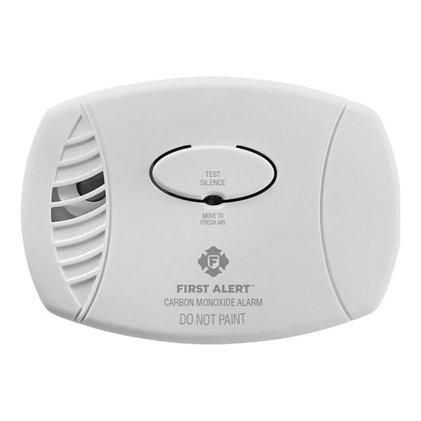 A white rectangular First Alert carbon monoxide alarm with a black button.