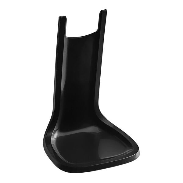 A black plastic Tork drip tray.