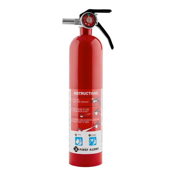 A red First Alert garage fire extinguisher with a white label and black gauge.