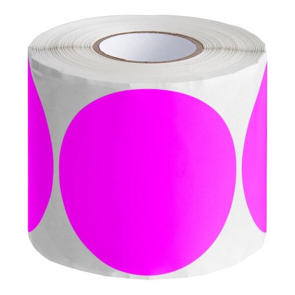 A roll of pink and white round inventory labels with a white background.