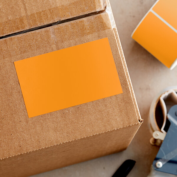 A cardboard box with a yellow rectangular label with black text.