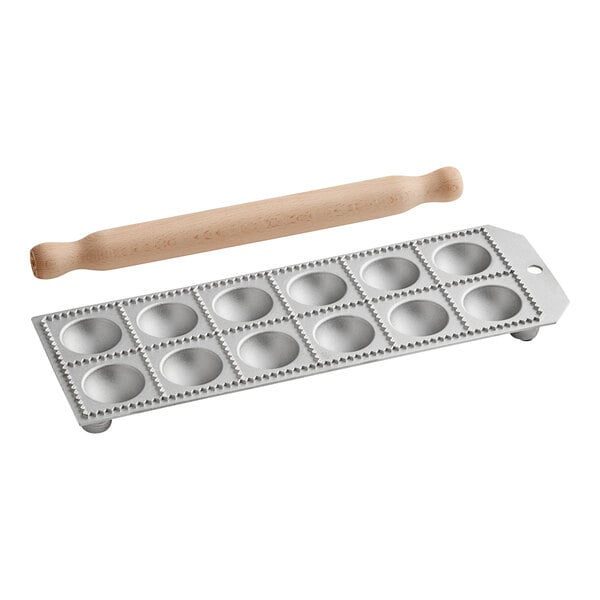 An Imperia ravioli mold with a wooden rolling pin.