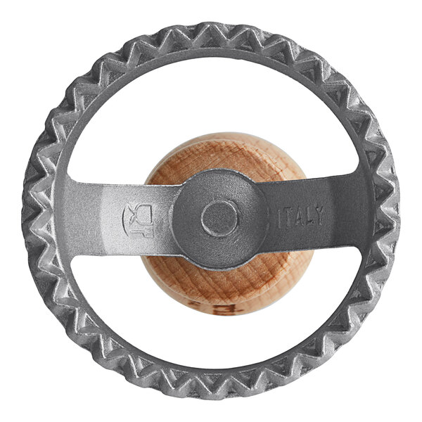 A circular metal Imperia ravioli cutter with a wooden handle.