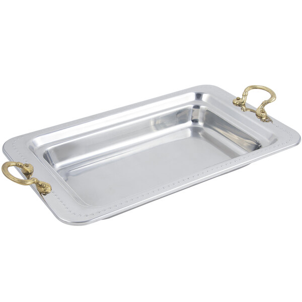 A silver Bon Chef rectangular food pan with round brass handles.