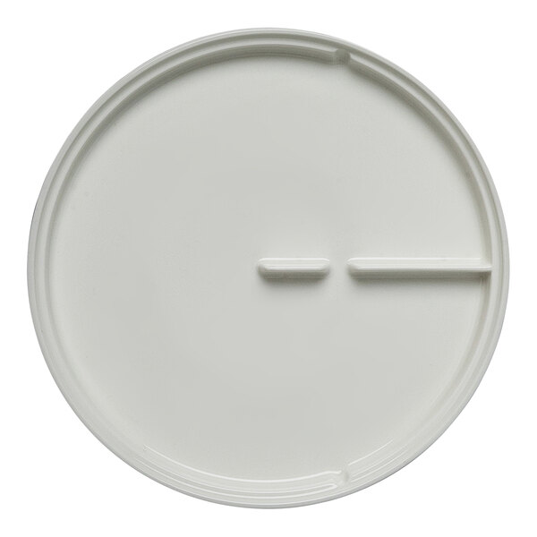 A close up of a white Sensate plate with a rim.