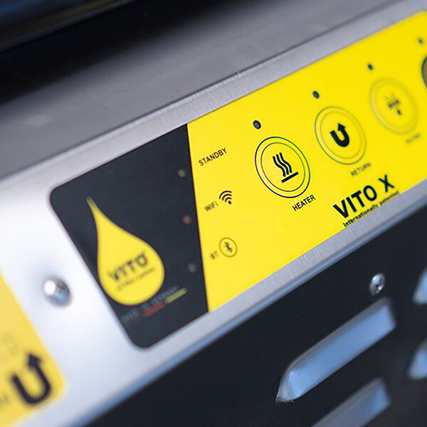 A VITO portable fryer oil disposal unit with a yellow and black label.