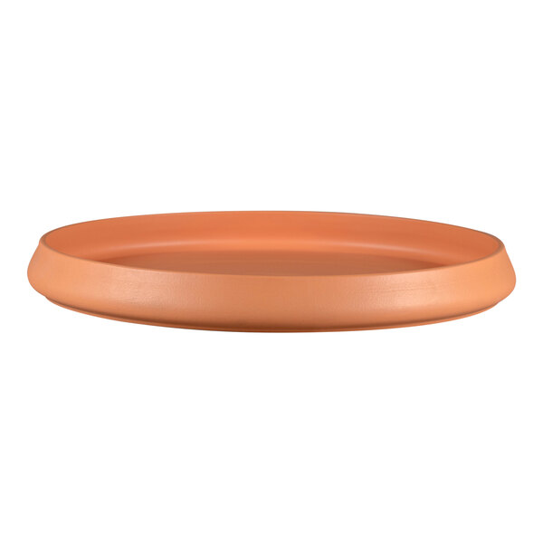 A round orange RAK Porcelain Tero Prima Baantna tray.