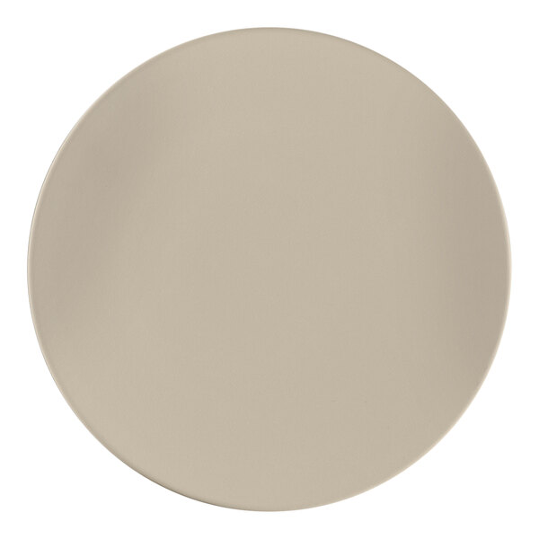 A close-up of a gray RAK Porcelain Argila Epura round flat plate with a white surface.