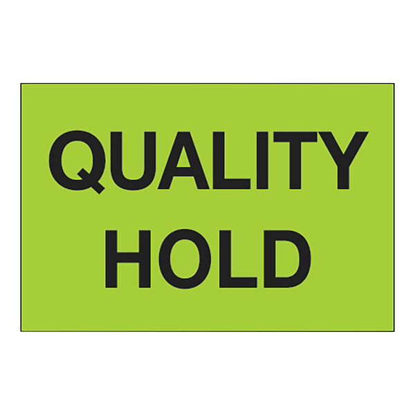 A rectangular green label with black text that reads "Quality Hold"