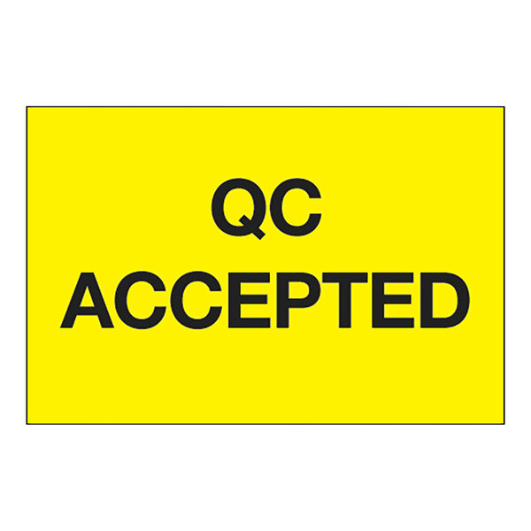 A yellow rectangular label with black text that says "QC Accepted"