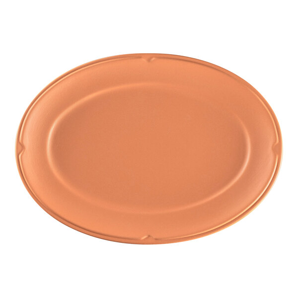 A close-up of a RAK Porcelain Tero Prima terra cotta oval plate with a brown rim.