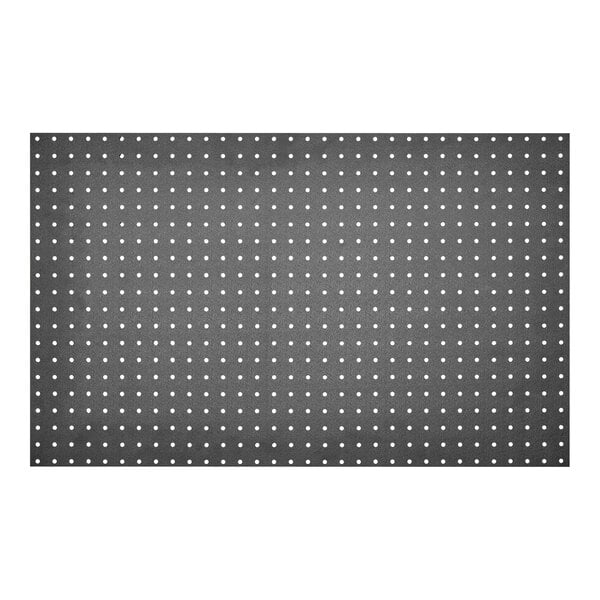 A close-up of a black and white fabric with a polka dot pattern.