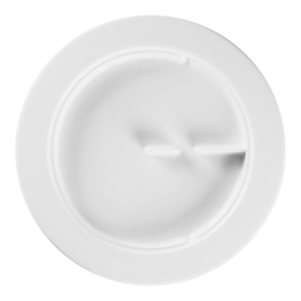 A white RAK Porcelain Sensate porcelain plate with a hole in it.