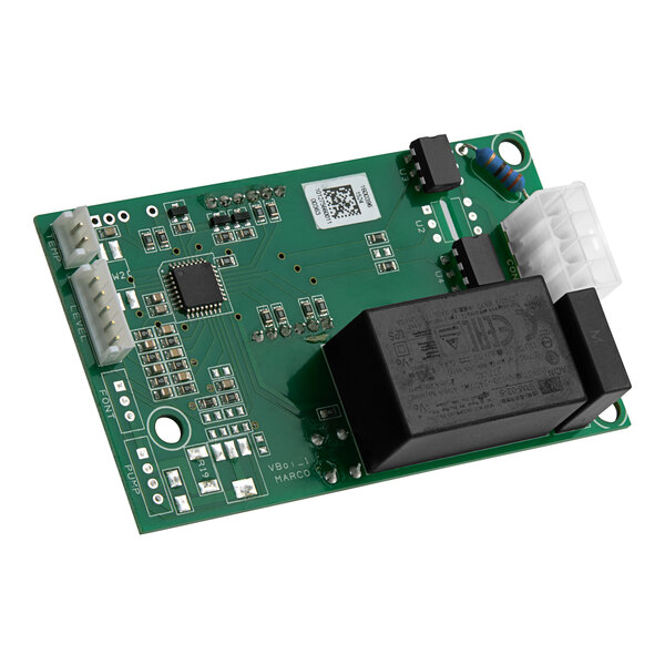 A green circuit board with many small components and black text on a black rectangular object.