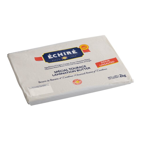 A stack of Echire unsalted butter sheets in white paper packaging.