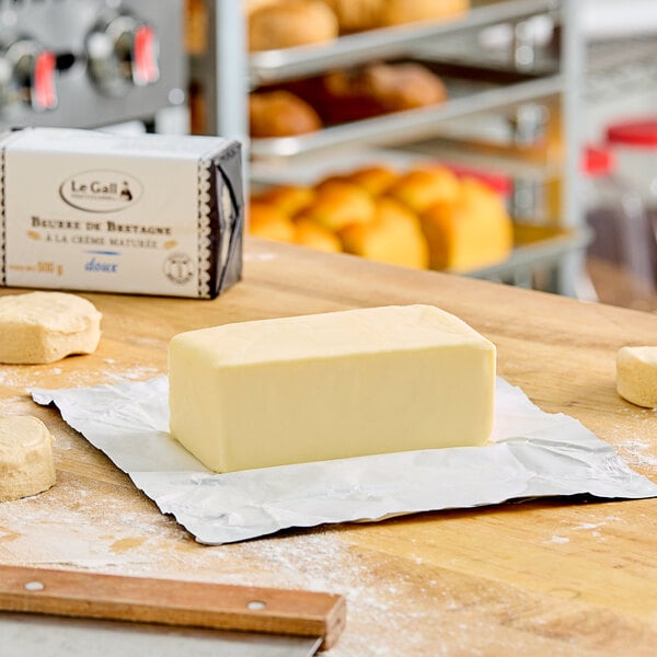 A block of Le Gall unsalted butter on a table with a paper.