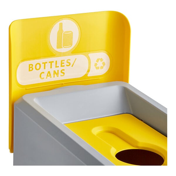 A yellow and white Rubbermaid recycling bin with a yellow lid.