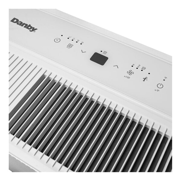 A close up of a white Danby dehumidifier.