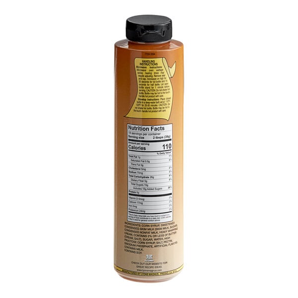 A close-up of a bottle of brown Lyons Old Fashioned Caramel Hot Fudge Topping.