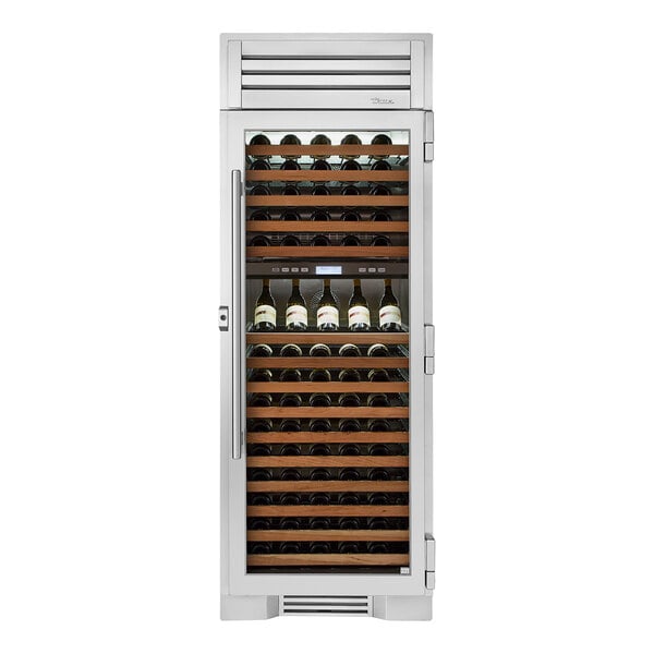 A True stainless steel dual zone wine cooler with a glass door filled with bottles of wine.